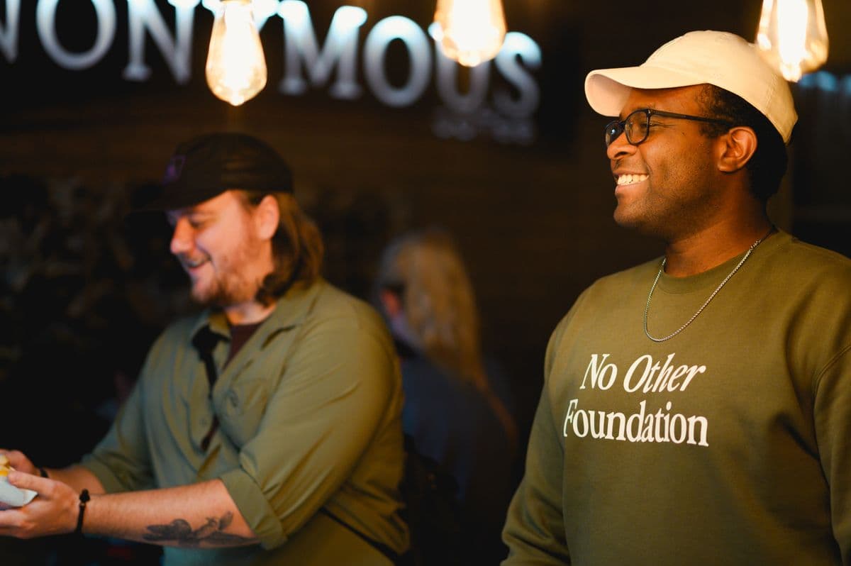 Terrance Maigi connecting with community members at Anonymous Coffee